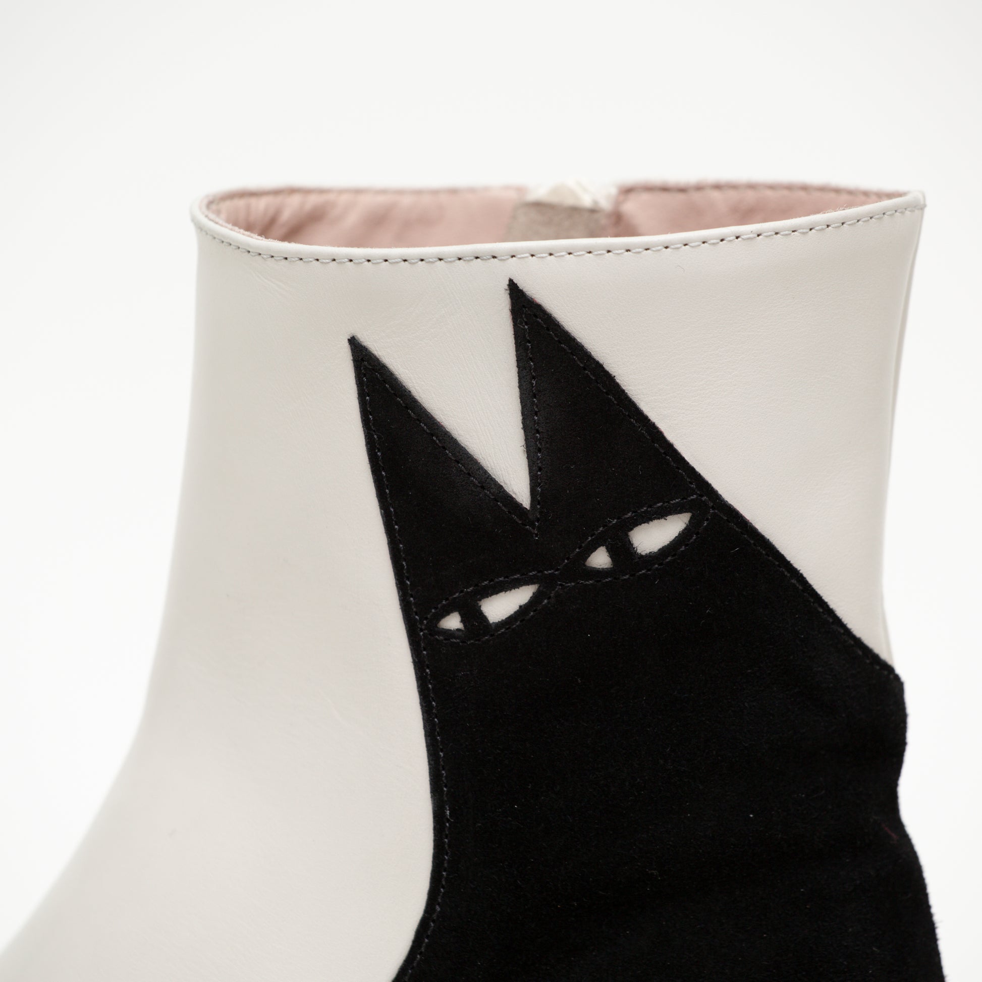 A detailed close up of the top of the Ziggy boot shows his cheeky eyes and the intricate high quality stitching on the boot.