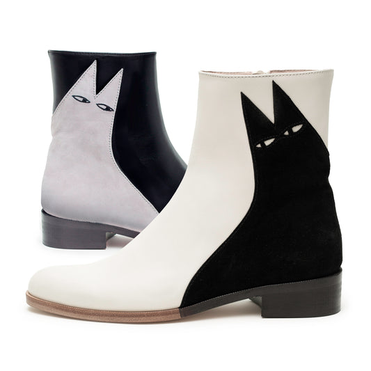 An iconic suede cat design on a low heeled black and white leather boot. Light grey Etta on black and a black Ziggy on white.