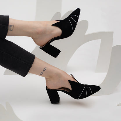 The Sylvie mules being modelled showing off the subtle and chic cat themed high heel shoe design. The model is also wearing some JJC cat tattoos.