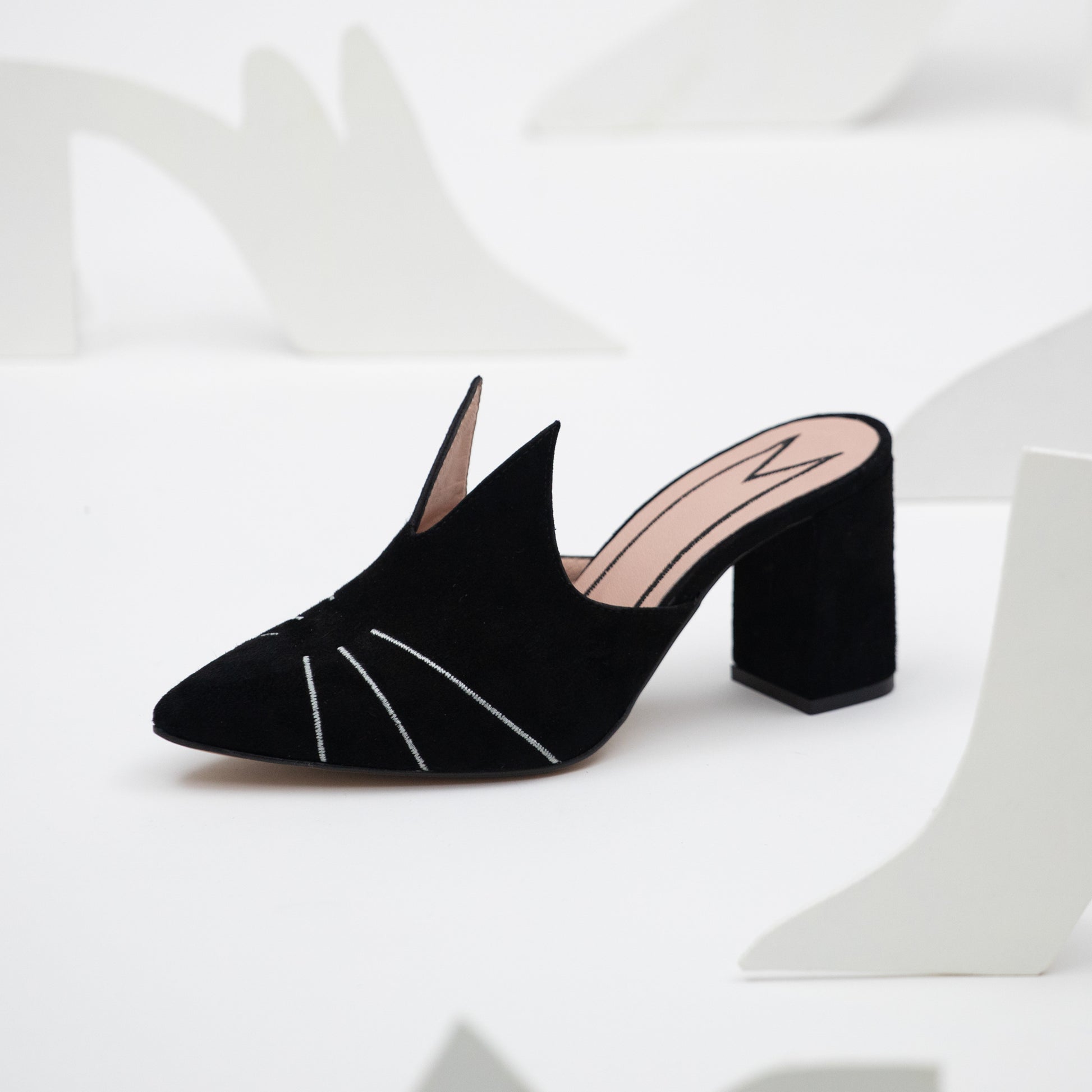 Elegant cat themed shoe in a mule style handmade from black suede pink leather and featuring silver whiskers and pointed cat ears.