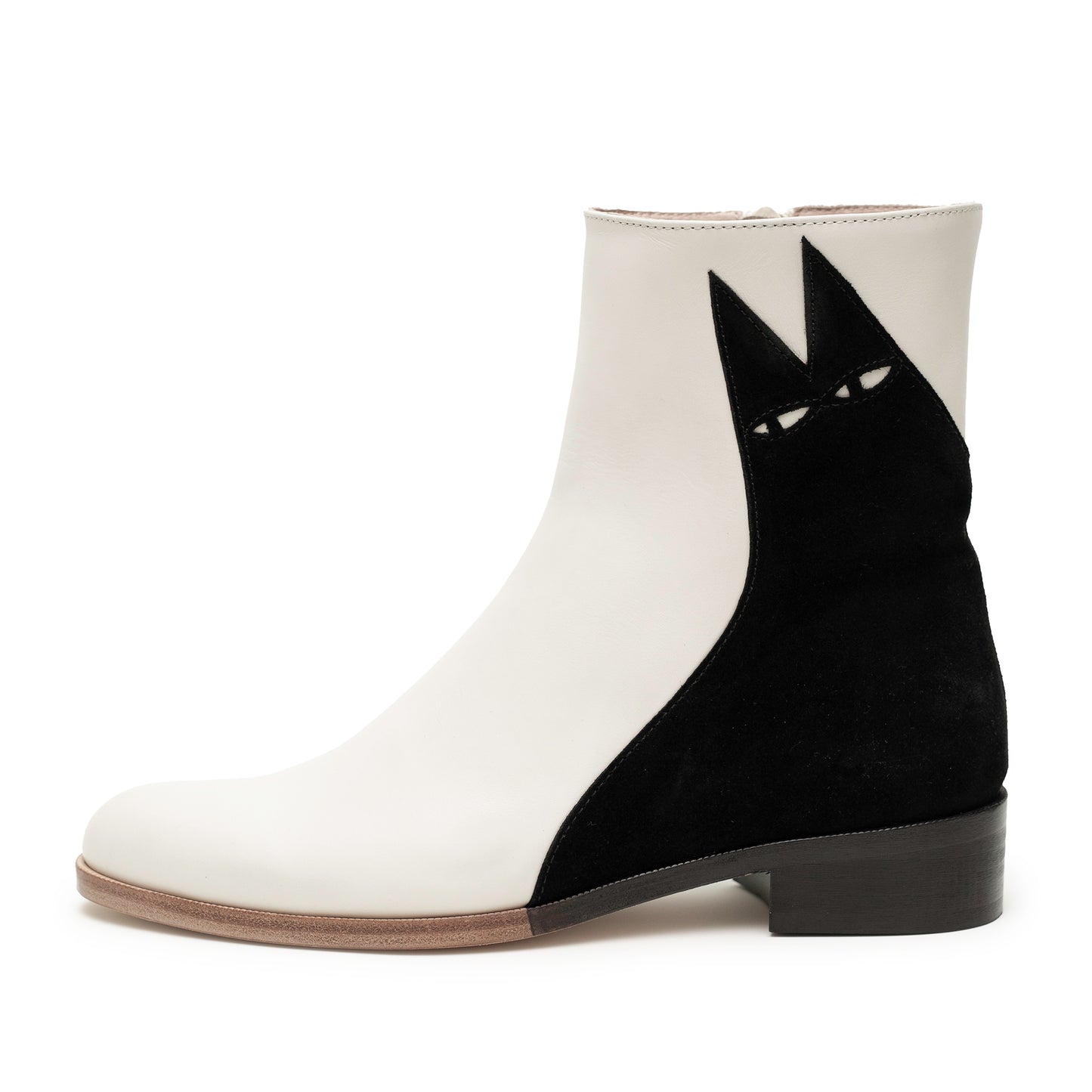 Handcrafted white leather low heeled boot with iconic black suede cat illustration across the side. The cat is called Ziggy.